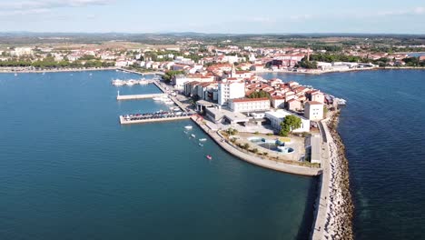 Umag-at-Istria,-Croatia---Aerial-Drone-View-of-the-Cityscape-with-Port,-Town-Center,-Boulevard-and-Church-Tower