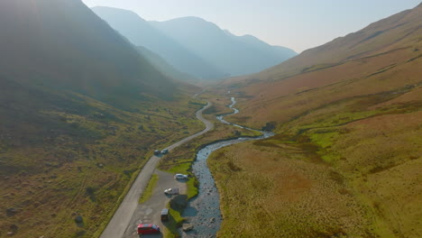 HONISTER-PASS-Lake-District-National-Park-in-afternoon-sunshine-and-shadows,-push-forward-and-down-through-valley-Mavic-3-Cine-Prores-422-March-2022---Clip-3