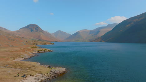WASTWATER-WASDALE-HEAD-Lake-District-Unesco-National-Park,-Aerial-Sunrise-pull-back-over-lake-at-low-level-then-elevating-Maviic-3-Cine-Prores-422---Clip-3