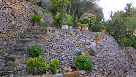 Beautiful-Landscaped-Garden-With-Cobblestone-And-Fresh-Flowers