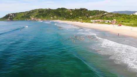 Aerial-Drone-Shot-of-Group-of-People-in-the-Sea-in-Summer-Brazil
