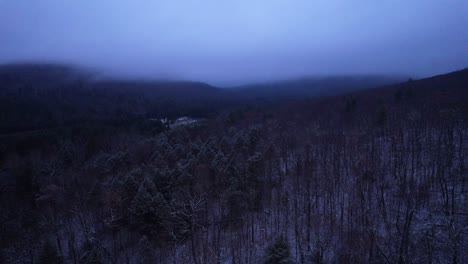 Aerial-drone-video-footage-of-magical-foggy-night-in-the-snowy-Appalachian-mountains-during-winter,-in-the-Catskill-Mountains-sub-range