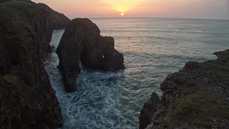 Sunset-Scenery-And-Rock-Formation-At-Perranporth-Beach-In-England---static-shot