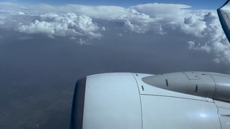 Stunning-Scenery-Of-The-Sky-And-Clouds-With-A-Plane-Engine-Wing-On-The-Center-Right-View--Aerial-Shot