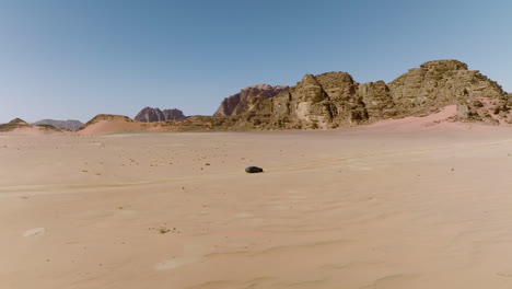 Car-Exploring-In-Wilderness-At-Wadi-Rum-Desert-In-Jordan