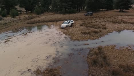 White-Offroad-Car-Crossing-Puddle-ans-Splashes-Water