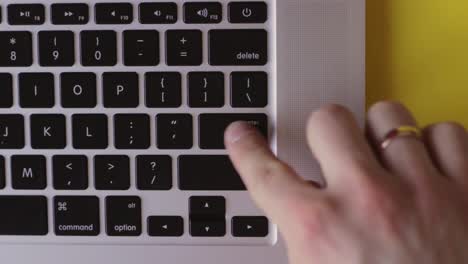 Keyboard-enter-button-does-not-work,-finger-pressing-repetitively,-sending-file,-top-view-static-closeup