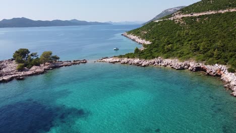 Aerial-View-of-a-Boat-Sailing-at-the-Adriatic-Sea-along-the-Coast-of-Dalmatia,-Croatia