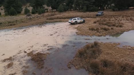 White-Offroad-Car-Crossing-Puddle