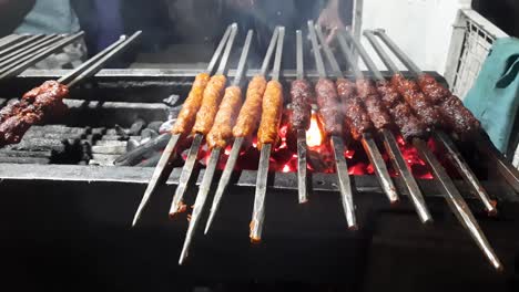Closeup-shot-of-cooking-beef-seekh-kebab-on-the-griller