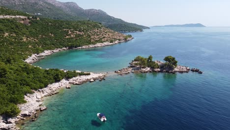 Aerial-Drone-View-of-a-Boat-Sailing-at-the-Adriatic-Sea-along-the-Coast-of-Dalmatia,-Croatia