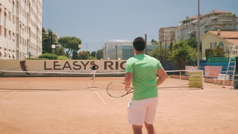 Friends-playing-together-on-tennis-court-on-sunny-day,-slow-motion