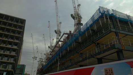Panning-shot-revealing-huge-empty-construction-site-near-Kings-Cross-station,-London