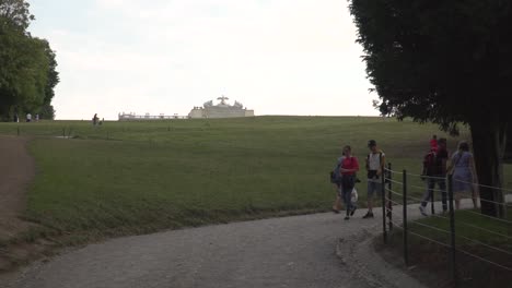 People-walking-up-path-to-Gloriette-at-Schönbrunn-Castle-in-Vienna
