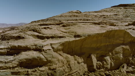 Fly-Over-Rock-Formations-On-The-Arid-Desert-Of-Wadi-Rum-In-Jordan