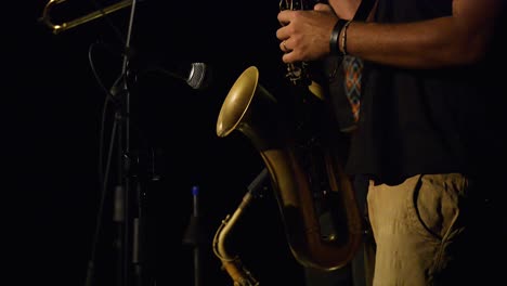 person-playing-saxophone-in-concert-live