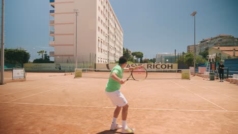 Tennis-player-hit-the-ball-back-to-opponent-on-clay-court