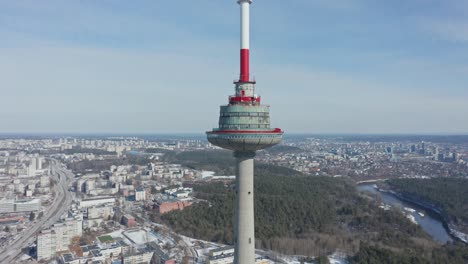 Aerial-Drone-Close-Up-Shot-of-Vilnius-TV-Tower-with-Vilnius-City-in-Background-on-Bright-Day