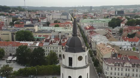 AERIAL:-Vilnius-Bell-Tower-with-Vilnius-City-in-Background-on-a-Summer-Evening