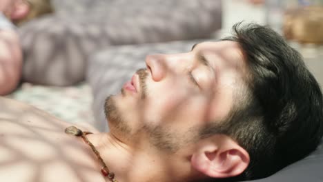 Closeup-of-a-young-beautiful-man-doing-breathwork-with-his-eyes-closed
