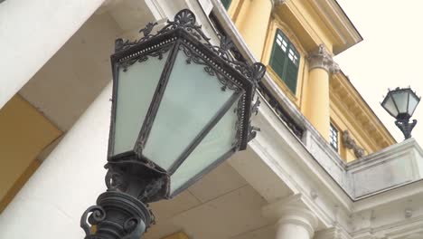 Rotating-slow-motion-video-of-lamps-at-facade-of-Schönbrunn-Palace-in-Vienna