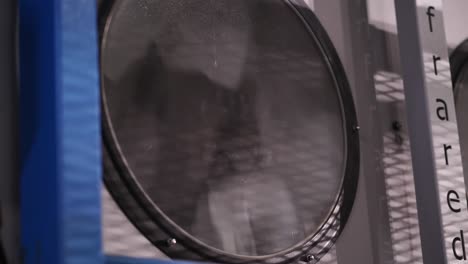 Close-Up-View-Looking-Through-Window-Of-Large-Industrial-Tumble-Dryer