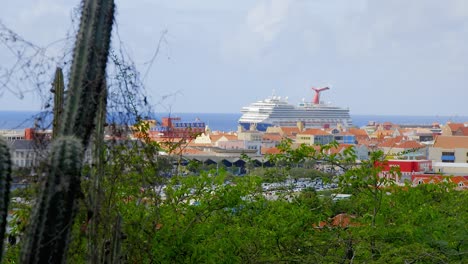 Large-cruise-ship-docked-in-tropical-Caribbean-city-of-Willemstad-on-the-island-of-Curacao