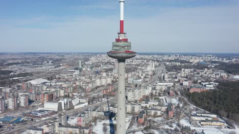Rotating-Aerial-Drone-Shot-of-Vilnius-TV-Tower-with-Whole-Vilnius-City-Visible-Around