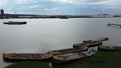 Drone-footage-of-old-abandoned-World-War-Two-concrete-barges-in-the-Thames-river,-that-were-an-integral-part-to-get-troops-and-equipment-on-to-the-beaches-during-the-of-the-D-Day-Normandy-landings