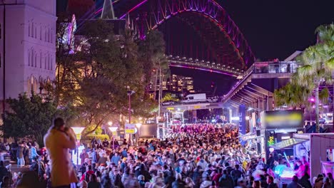 Time-lapse-of-a-Photographer-taking-photos-of-crowds-at-Sydney's-Vivid-festival-with-the-Sydney-harbour-bridge-in-the-background