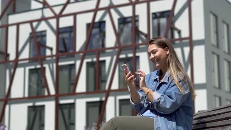 Girl-laughing-and-is-happy-with-the-message-or-what-she-saw-on-the-phone