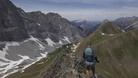 Hiker-on-mountain-ridge-walking-carefully-Rockies-Kananaskis-Alberta-Canada