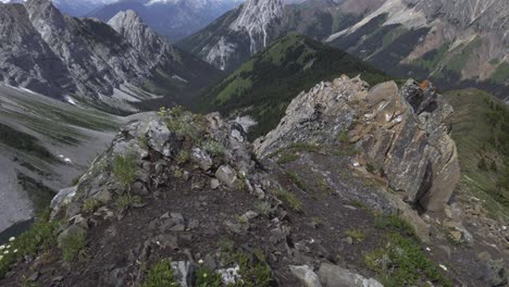 Mountain-lake-revealed-between-rocks-stones-Rockies-Kananaskis-Alberta-Canada