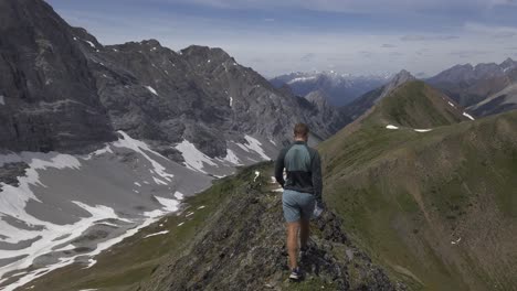Hiker-on-mountain-ridge-walking-carelessly-Rockies-Kananaskis-Alberta-Canada