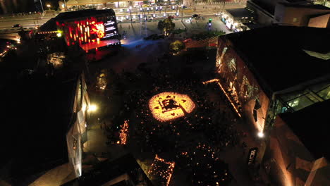 Static-aerial-perspective-of-Federation-Square-during-evening-concert-below