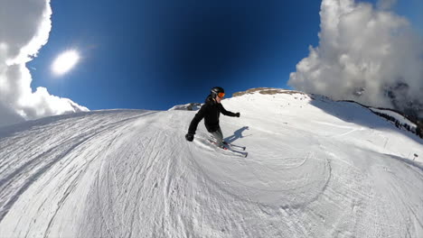 A-young-skier-is-going-down-a-ski-slope-in-the-Swiss-alps,-selfie-view-with-360-GoPro