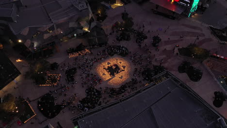 Aerial-perspective-during-dusk-evening-light-with-many-onlookers-enjoying-the-space