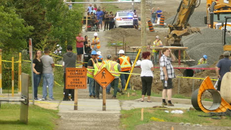 Horrible-accident-where-two-workers-died-and-getting-retrieved-by-an-active-trench-rescue,-Co-workers-wait-for-anticipation