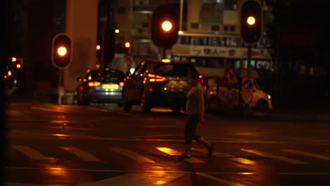 Hongkong--August-07,-2022:-peoples-at-night-walking-across-zebra-cross-when-the-red-light-is-on