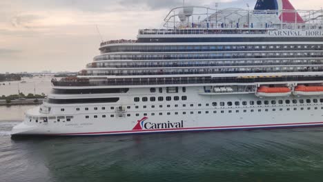 A-Huge-Luxury-cruise-ship-Sailing-from-port-of-Miami-close-up-shot-video-background-in-4K-|-Carnival-Horizon-Cruise-ship-sailing-from-port-|-Vacation,-Travel,-Tourism,-Fun,-enjoy