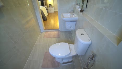 Small-Restroom-With-Light-Beige-Ceramic-Tile,-No-People,-Dolly