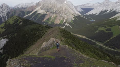 Hiker-running-down-the-ridge-Rockies-Kananaskis-Alberta-Canada