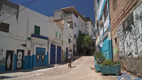 Man-walking-in-Taghazout-street-Morocco