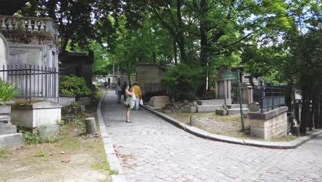 Walking-Shot-Inside-the-Cemetery-of-Pere-Lachaise-With-Tourists-wandering-Around,-Paris-France