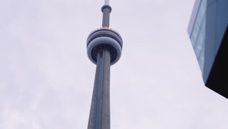 Stable-reveal-and-pan-up-of-CN-Tower-in-Toronto,-Canada