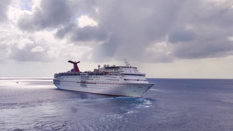 Carnival-Cruise-liner-sailing-from-port-of-Mexico-in-middle-of-the-Caribbean-sea-with-cloudy-weather-video-background-in-4K-|-Carnival-cruise-ship-sailing-in-middle-of-the-Caribbeans-sea-video-in-4K