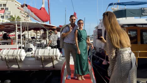 Guests-taking-pictures-in-front-of-the-Catamaran-sail-boat-in-southern-France