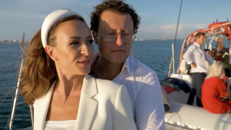 Couple-enjoying-the-sunset-on-catamaran-sailing-boat