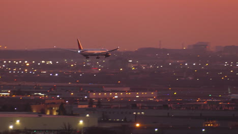 Air-Canada-Boeing-787-Dreamliner-Airplane-Landing-on-Toronto-International-Airport-at-Twilight,-Tracking-Shot