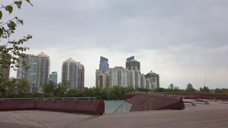 City-skyscraper-skyline-from-a-deck-by-river-pan-approached-Memorial-Drive-Monument-Calgary-Alberta-Canada